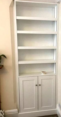 fitted alcove shelving and cupboard  