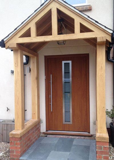 Modern timber front door with single glazed panel and oak framed porch