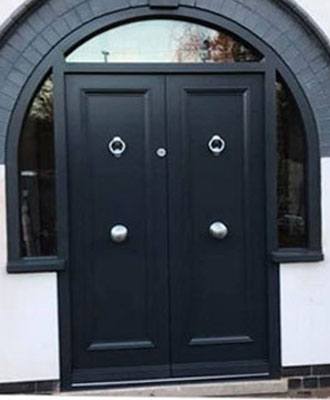Double wooden front doors with arched glazed side panels