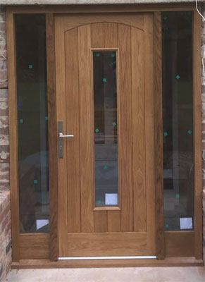 Modern wooden front door, single glazed panel and side windows