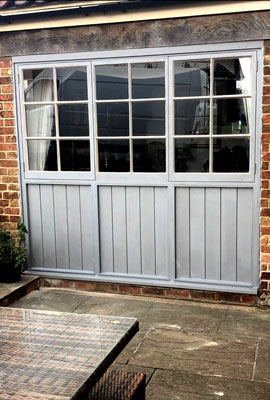 Casement windows and wooden panels to fit within existing opening