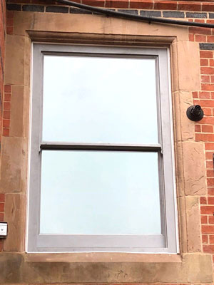 Two pane timber sash window with obscured glazing for bathroom